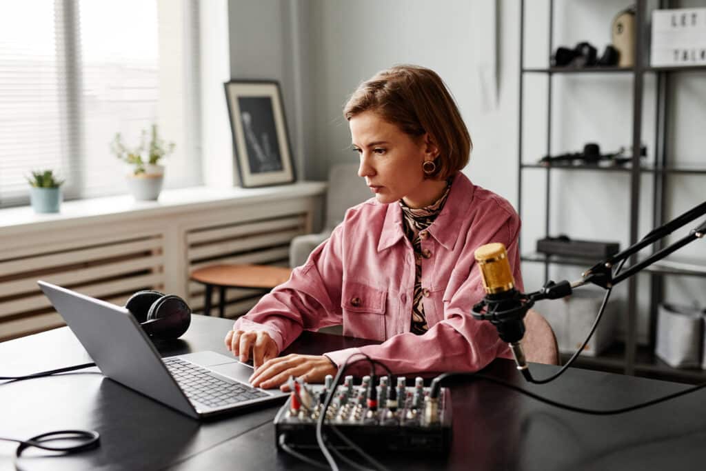 female content creator preparing a B2B sales podcast